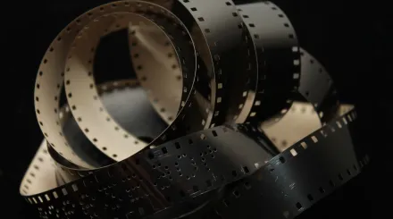 a spool of film on a black background