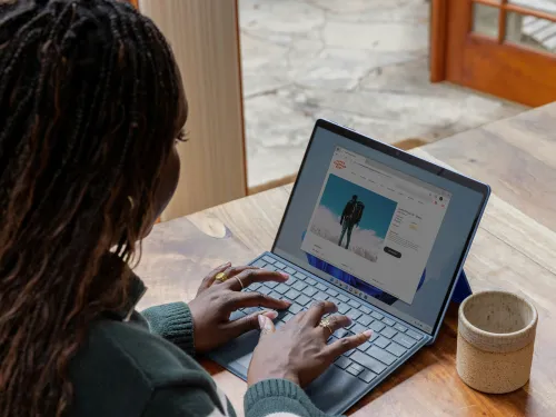 woman working on a laptop at her table